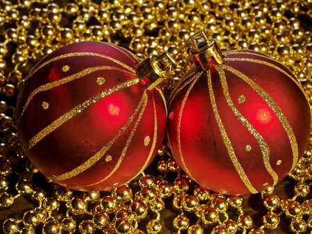 Two red christmas tree balls,taken using  painting with light technique    の写真素材