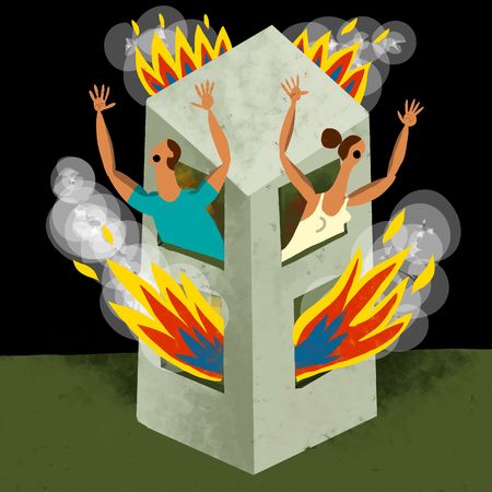 Couple asking aid in a burnig buildingの写真素材