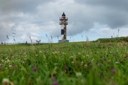 lighthouse of cabo de ajo painted by the artist Okuda in Cantabria