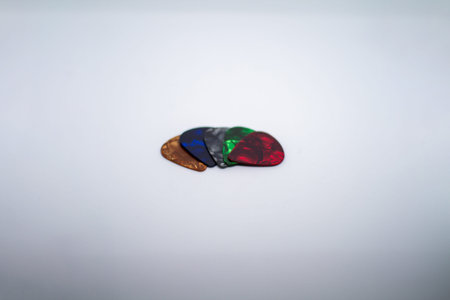 guitar picks of multiple colors and thicknesses