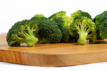 broccoli on a wooden board on a white background in the studio