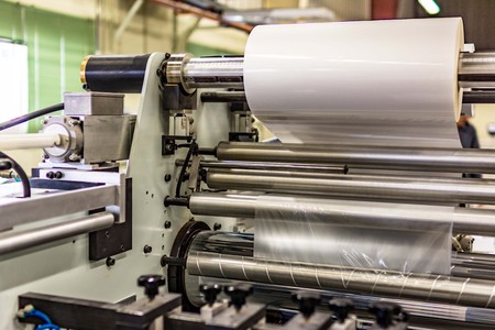Matte or gloss plasticized machine in a printing press for a perfect finish of printed documents. Ideal for an impressive finishの写真素材