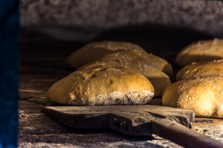 Elaboration of bread in traditional wood ovenの写真素材