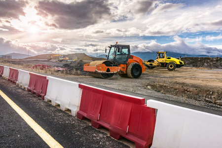 Group of road rollers repairing a section of a road
