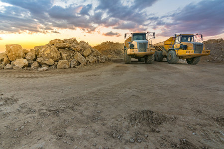 Large trucks in an open pit mine