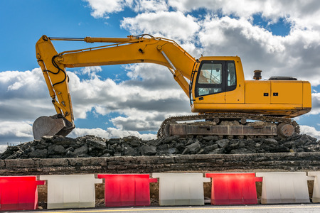 Construction machinery renovating a section of a roadの写真素材