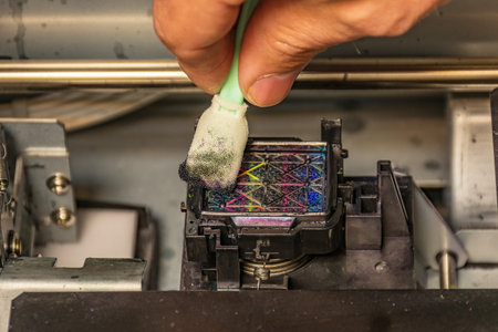 Cleaning the inkpad of a large format printing plotter