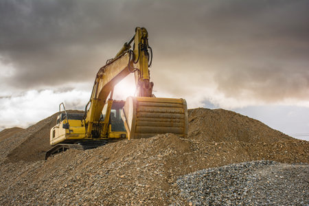 Excavator on the road construction works. Machinery needed for construction