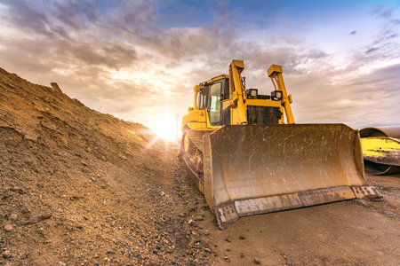 Excavator on the road construction works. Machinery needed for construction