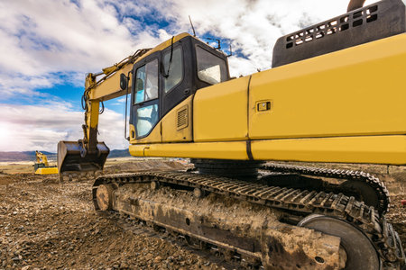 Excavator on the road construction works. Machinery needed for construction