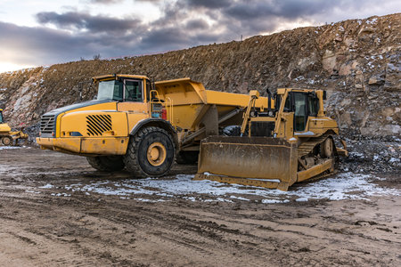 Excavator collecting stone in an open-cast mine