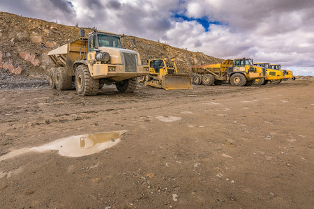 Large trucks in an open pit mine