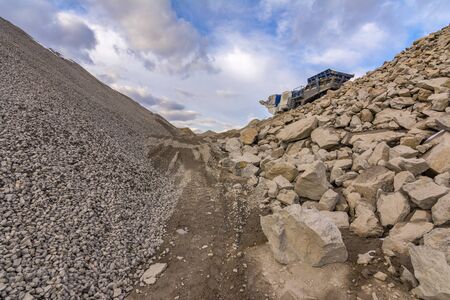 Mechanical conveyor belt to pulverize rock and stone and generate gravelの写真素材