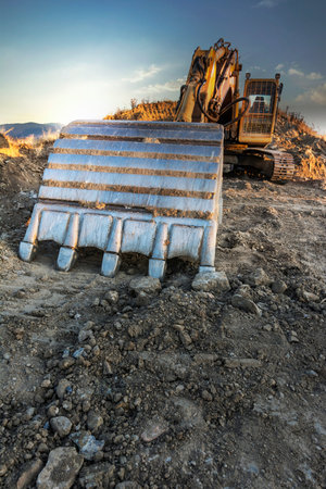 Excavator machine on road construction works, moving earth