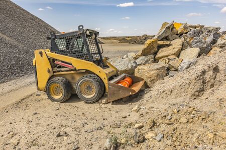 Small excavator perfect for working in small placesの写真素材