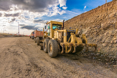 Excavator machine leveling the ground with a large shovel