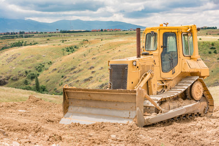 Excavator moving earth on a road construction works