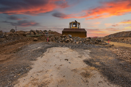 Excavator building a road in a site construction