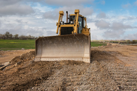 Excavator building a road in a site construction