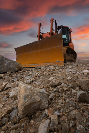 Excavator building a road in a site construction