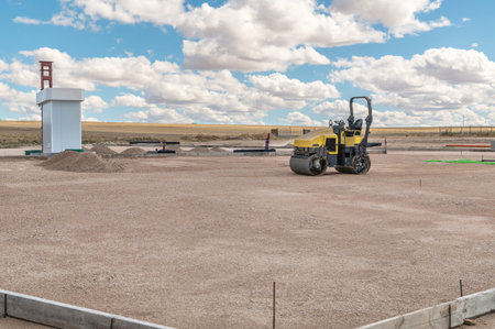 Small steamroller at a construction site, leveling the ground