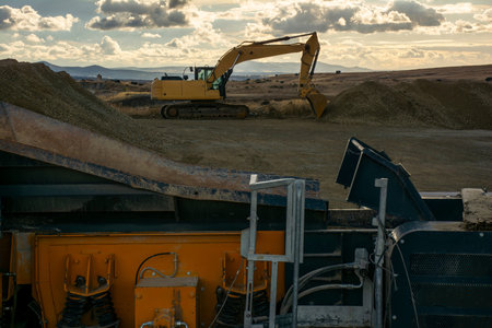 Excavator at a construction site during a beautiful sunset