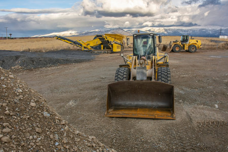 Excavator at a construction site during a beautiful sunset