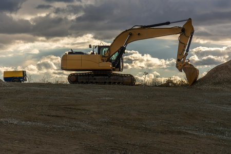 Excavator at a construction site during a beautiful sunset