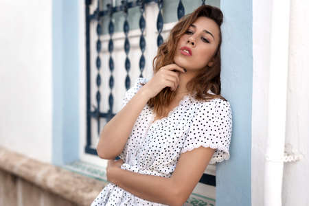 Portrait of woman in red flowerの写真素材