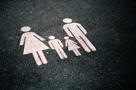 Sign of a family painted on the roadの写真素材
