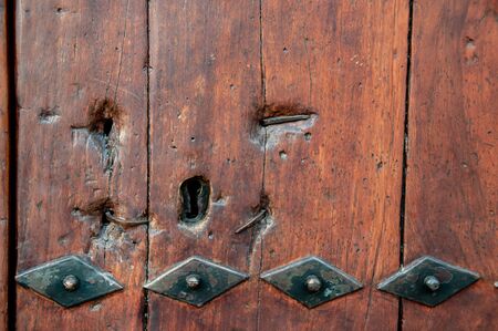 wooden door with metal insertsの写真素材