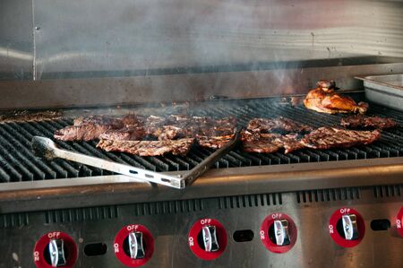 American grill restaurant with meat ready to serveの写真素材