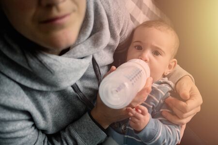 Mother feeding his newborn babyの写真素材