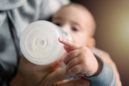 Mother feeding his newborn babyの写真素材