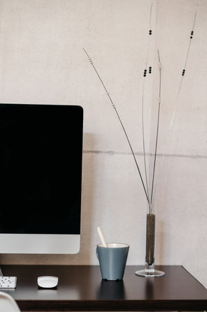 A desk with a computer on a table