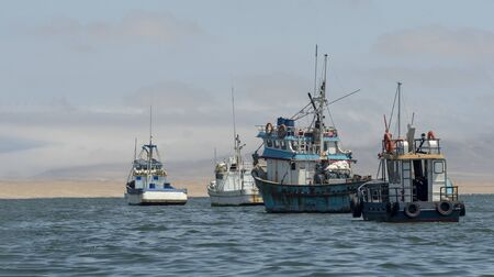 Fishing boats going out to sea fishingの写真素材