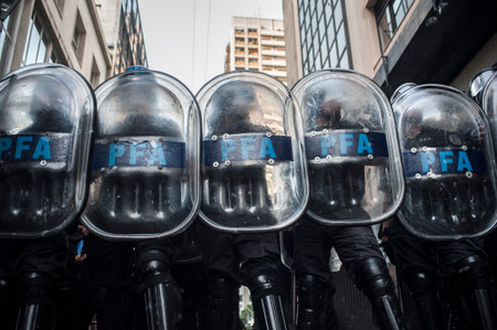 A group of police officers ready to take action in protest in the streets of Buenos Aires