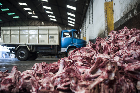 A truck leaves the giblets in a fat deposit in Mataderos, neighborhood of Buenos Airesのeditorial素材