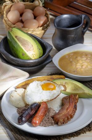 Colombian typical food, with meat, rice, egg, salad, banana and beansの写真素材