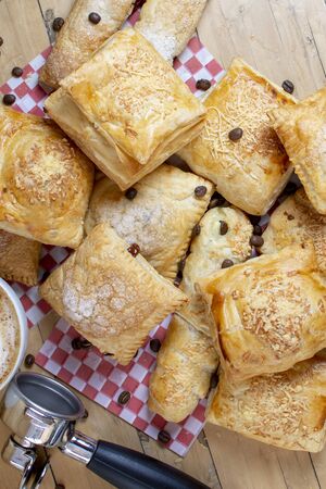 Variety of bakery products, sweet cakes, with cheese and breadsの写真素材