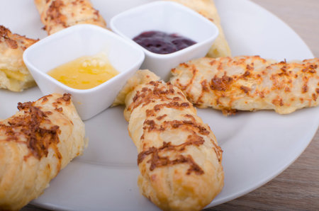Baked cheese stick on wooden background