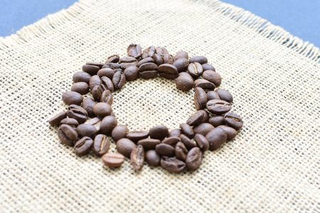 Roasted coffee beans, ready to be ground displayed in containers