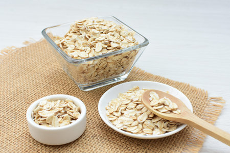 Oat flakes (Avena sativa) displayed in containers