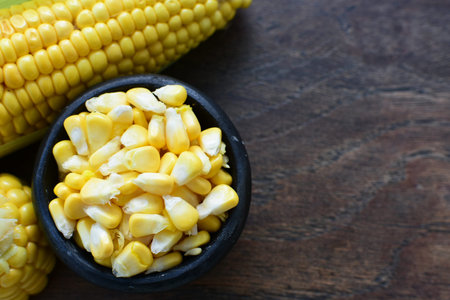 yellow sweet corn (cob) and green husk, chopped and shelled corn