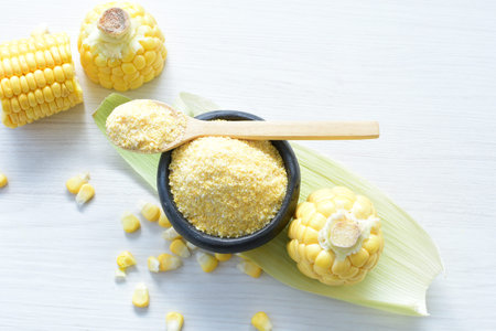 yellow sweet corn (cob) and green husk, chopped and shelled corn