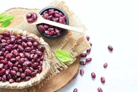 (Phaseolus vulgaris) Red beans displayed in different containers on flat bottomsの写真素材