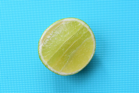 (Citrus - latifolia, the Persian lemon, whole and in pieces tahiti lemons accompanied by salt with...