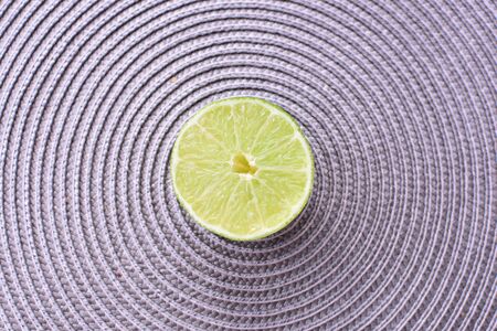 (Citrus - latifolia, the Persian lemon, whole and in pieces tahiti lemons accompanied by salt with an intense greenの写真素材