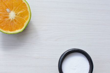 (Citrus - latifolia, the Persian lemon, whole and in pieces tahiti lemons accompanied by salt with an intense greenの写真素材