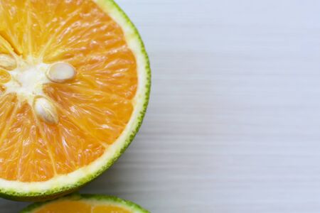Citrus - latifolia, Persian lemon, Tahiti lemons and whole and diced oranges accompanied by salt with an intense green and yellow greenの写真素材